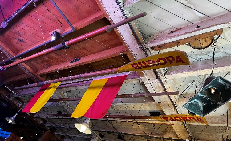 Lyall Bay SLSC oars and flags in the Attic at Wellington Museum