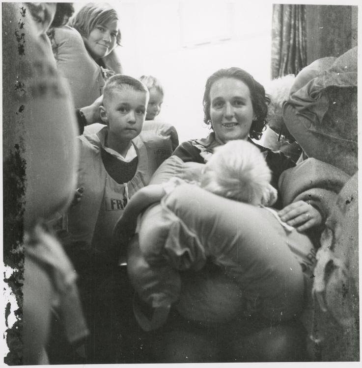 Shirley Hicks with son David and baby Gordon awaiting instructions.