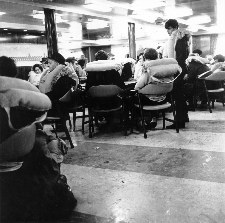 TEV Wahine passengers, in a lounge awaiting instructions after striking Barrett Reef