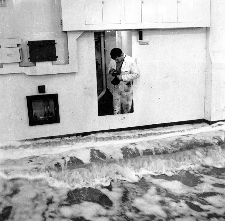 Engineer takes photograph of water on the vehicle deck