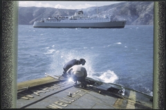 Salvors at work on wreck of TEV Wahine, with Inter Island ferry Aramoana in background.
