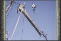 Mast of  TEV Wahine hanging from floating crane Hikitia