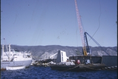 The salvage vessel Holmpark beside the TEV Wahine wreck