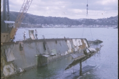 A crane lifting a piece of the TEV Wahine wreck out of the water