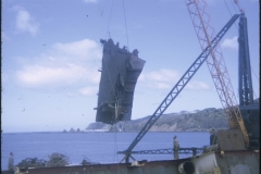 A piece of the TEV Wahine wreck lifted by a crane